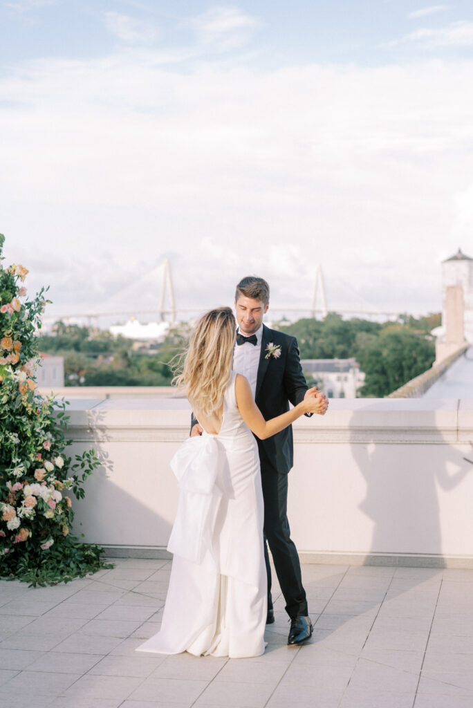 Bride and groom dancing on the rooftop at Hotel Bennett in Historic Charleston Micro wedding elopement