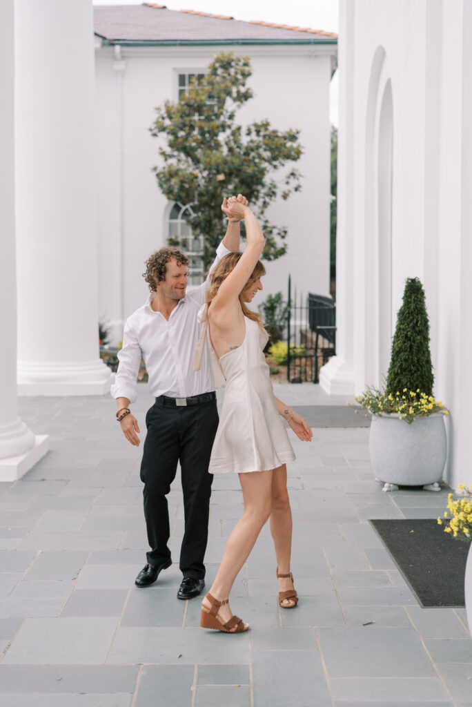 engaged couple dance together in Charleston