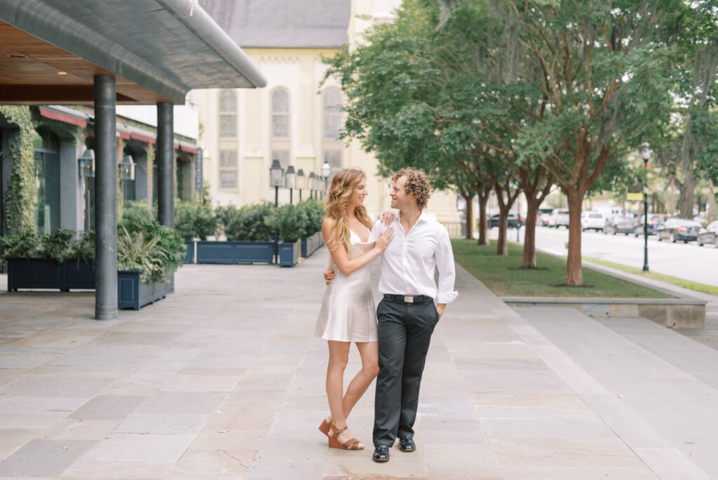 Couple hug each other in front of the Dewberry