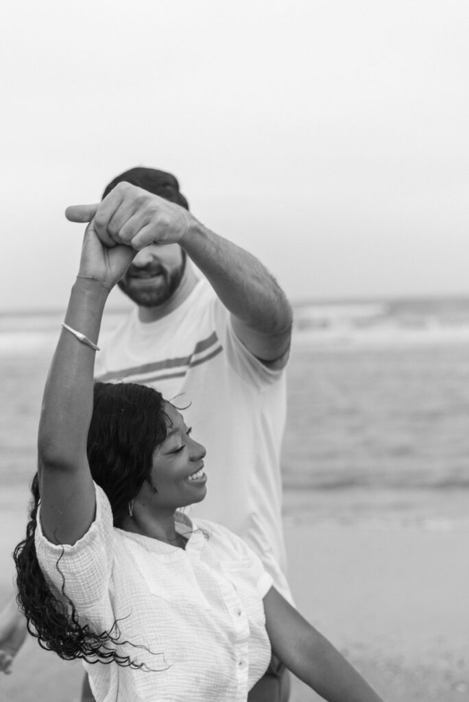 black and white image of an engaged couple 