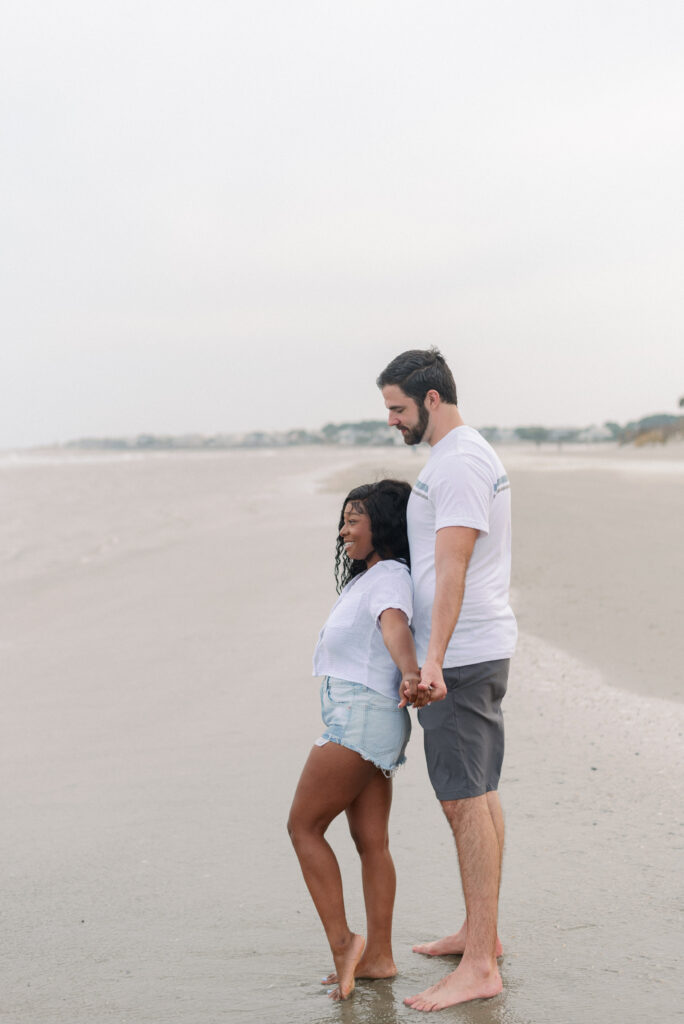 Couple leaning against each other on Isle of Palms beach