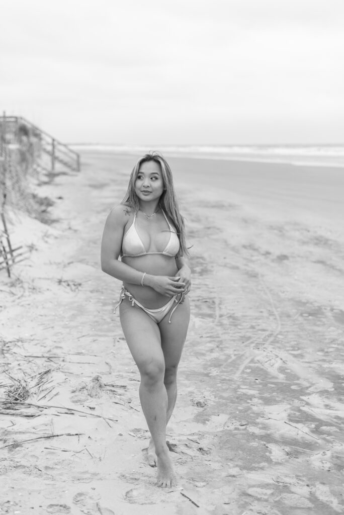 black and white portrait of a woman in a silver swimsuit