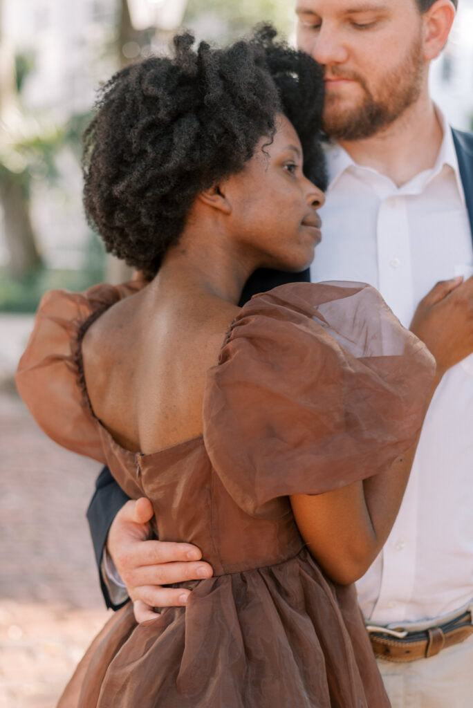 Close up of puff sleeve detail on brown tulle dress