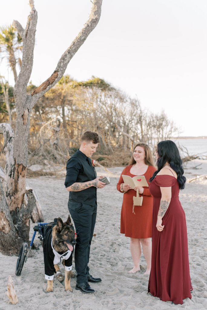 A couple elopes on the beach with their best friend officiating