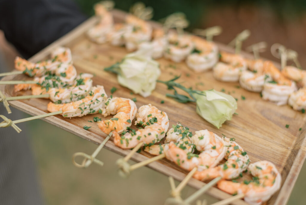 Shrimp served on a wooden serving board at an elopement