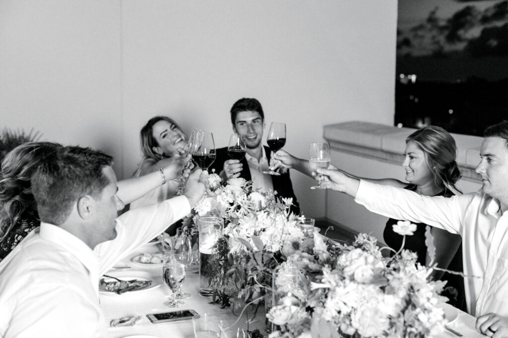 Bride and Groom share a meal with their intimate wedding party at their elopement