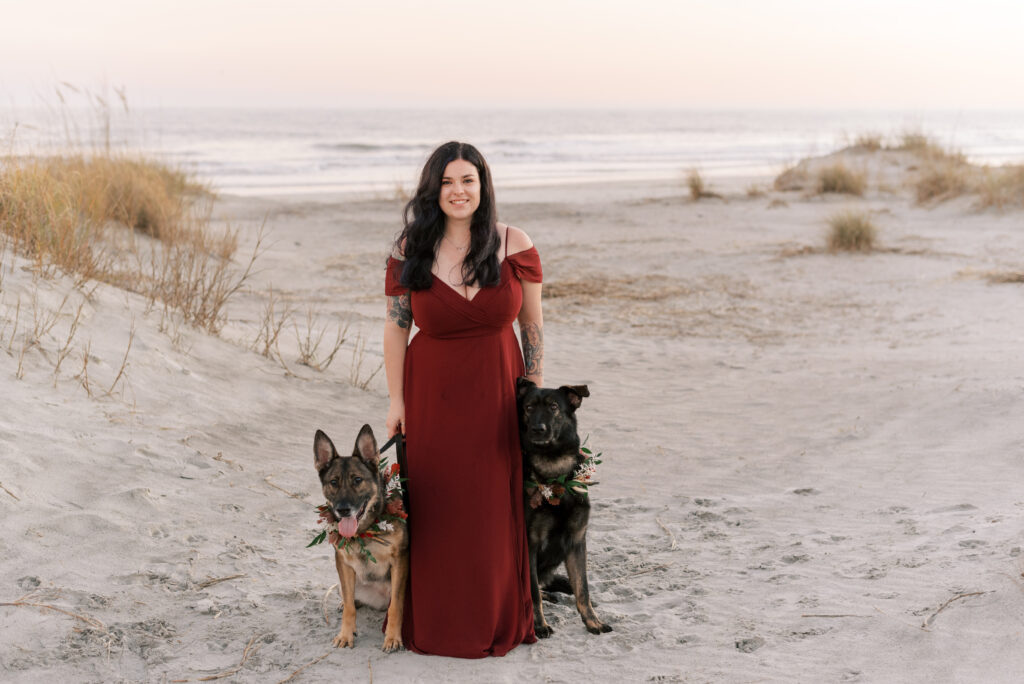 Bride with her two dogs wearing floral collars 