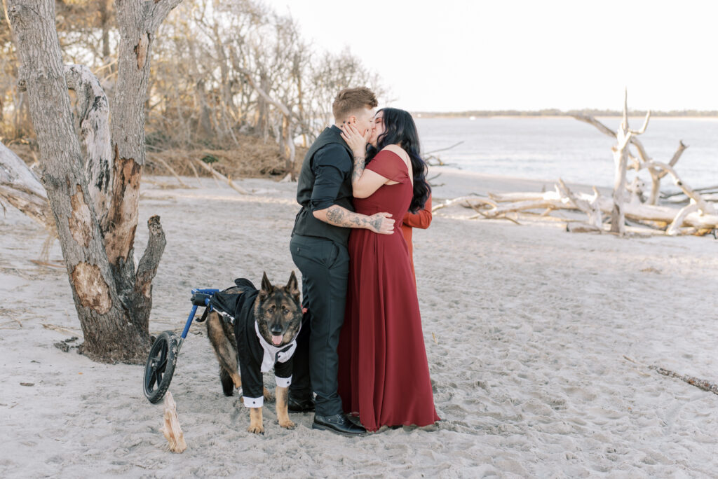 Two brides share a kiss at their wedding ceremony